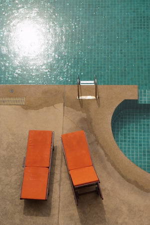  A swimming pool with couch on a top viewのeditorial素材