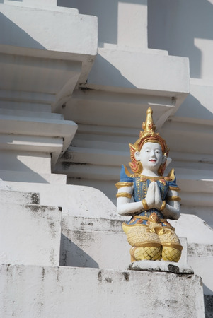 Thai fairy sculpture sit on the pagoda の写真素材