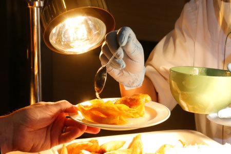 Chef putting sweet sauce on the fried dumplingの写真素材
