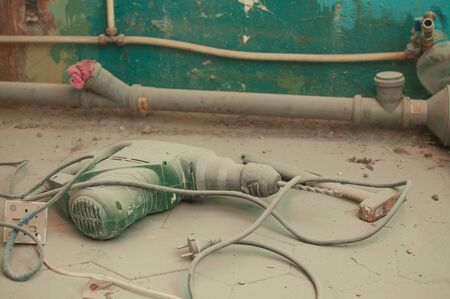 The bathroom is in the process of repair. Floor, dust, hammer, puncher.の写真素材
