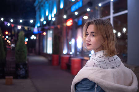 Russia, Ulyanovsk, October 12, 2019. Portrait of a girl walking in the evening city.のeditorial素材