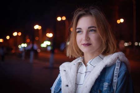 Russia, Ulyanovsk, October 12, 2019. Portrait of a girl walking in the evening city.のeditorial素材