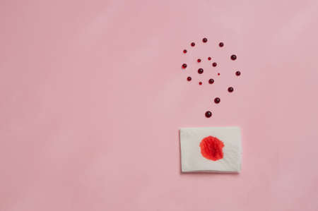 Metaphor of the anus on a pink background. concept of the cause rectal bleedingの写真素材