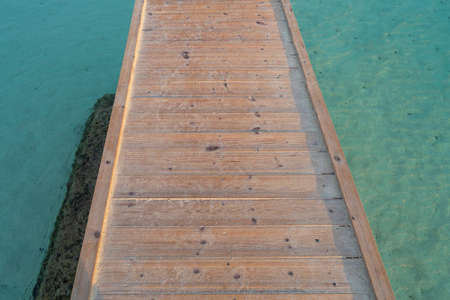 Wooden jetty in the turquoise seaの写真素材