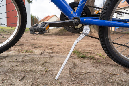 Standing blue children's mountain bike in the parkの写真素材