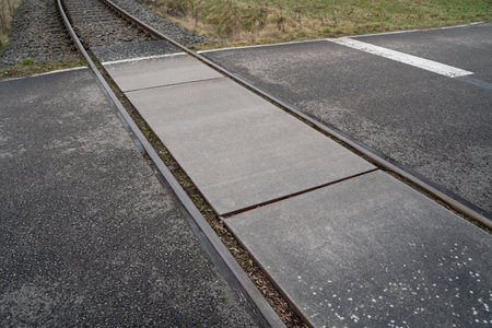 Level crossing on a paved road in the countrysideの写真素材