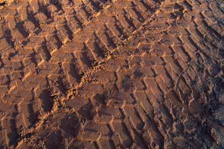 Tire tracks from wheel loader in the sandの写真素材