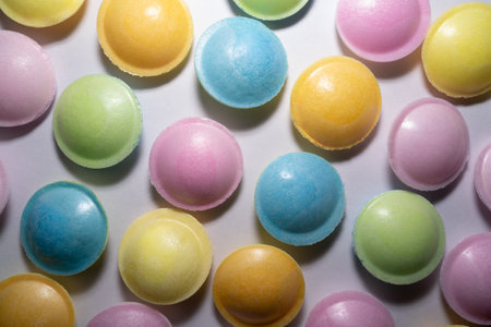 Background with a lot of colorful round candiesの写真素材
