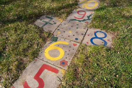 Hopscotch game for children painted on the floor with colorful numbersの写真素材