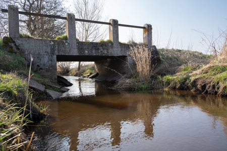 Small old concrete bridge over a creek in the countrysideの写真素材