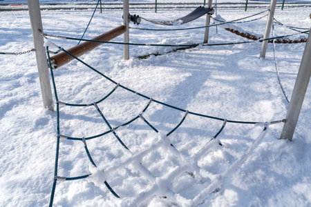 Playground with snow in winter