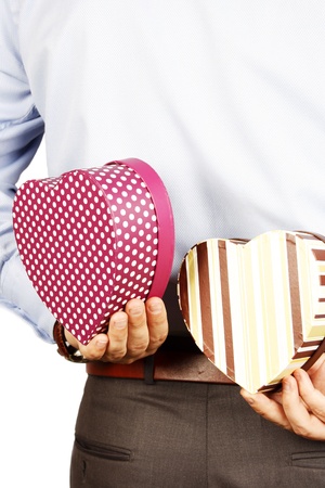 Businessman hiding a heart giftの写真素材