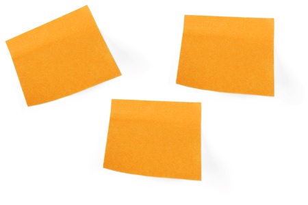 Orange sticky note isolated on white backgroundの写真素材