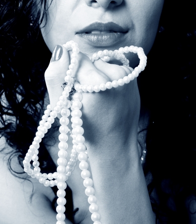 Beautiful woman with pearl necklaceの写真素材