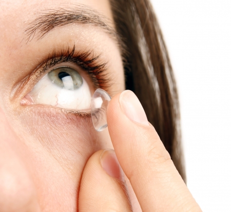 Woman inserting a contact lensの写真素材