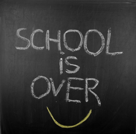 School is over on blackboardの写真素材