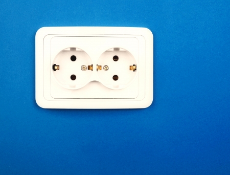 Power outlet on blue wallの写真素材