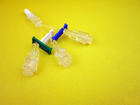 multiway vein valve on yellow backgroundの写真素材