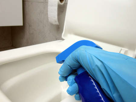 Disinfecting the toilet. Toilet cleaning and disinfection. Prevention of coronavirus infection.