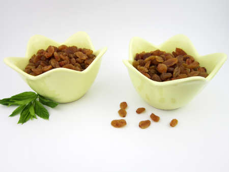 two bowls of yellow golden raisinsの写真素材