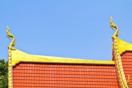 thai art roof of temple the blue sky backgroundの写真素材