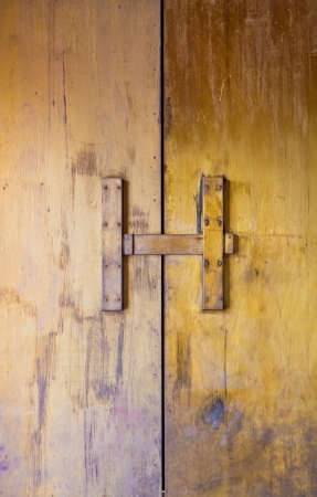 golden rusty color door in thai templeの写真素材