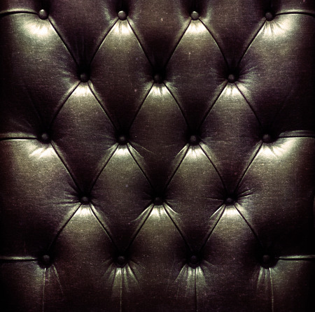 a photo of close up leather upholstery sofa,classic retroの写真素材