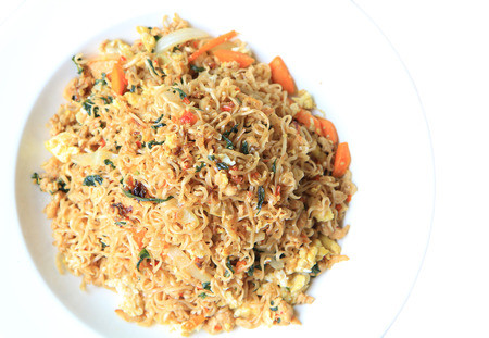 a photo of instant noodle pan fried on white dish,isolated on white backgroundの写真素材