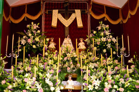 The crosses found everywhere on houses and paths are decorated with flowers and fruits.のeditorial素材