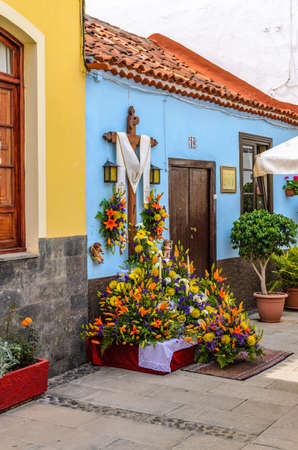 The crosses found everywhere on houses and paths are decorated with flowers and fruits.のeditorial素材
