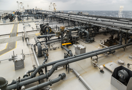 Cargo deck of oil product carrier in the sea during rain.の写真素材