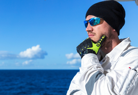 Alone traveler on the boat in the blue sea.の写真素材