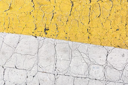 Cracked asphalt of the roadの写真素材