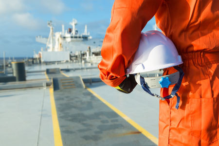 Orange robe engineer on the deck.の写真素材