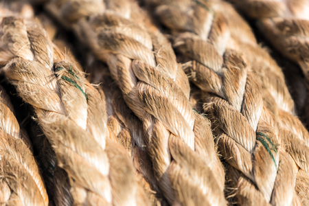 Closeup view of the used mooring rope of a merchant ship.の写真素材