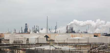 Panorama of an oil refinery with smoky smokes under a cloudy sky.の写真素材