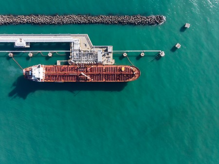 Aerial view of an red oil tanker at jetty.の写真素材