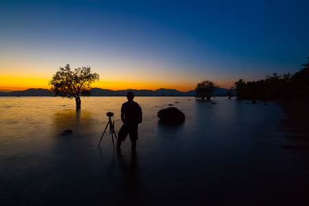 PhotographerSeascape man,  Long exposure seascape during sunset beautiful time, Phuket Thailand.の写真素材
