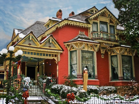 Holiday Decorated Victorian House with Snowのeditorial素材
