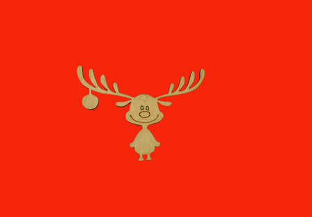wooden Christmas toy deer on a red background. positiveの写真素材