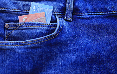 euro banknote in jeans pocketの写真素材