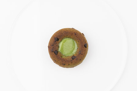 Chocolate muffin with kiwi on a white background.の写真素材