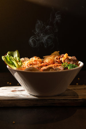 japanese food, kimchi udon on dark background