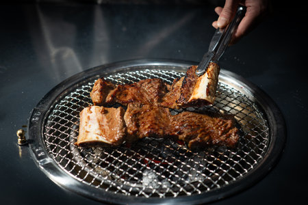 grilled meat on the grill in the restaurant, close-up