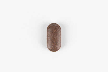 Close-up of a pill on white background. Isolated.の写真素材