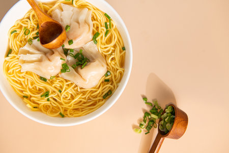 Vietnamese noodles with dumplings in a bowl on the table