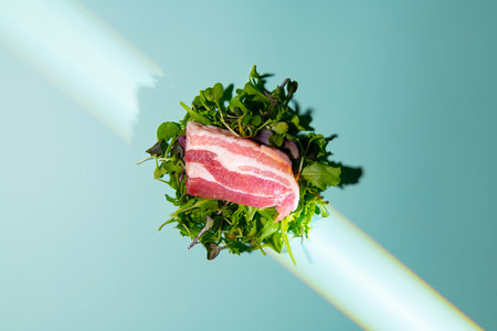 Beef fillet with arugula on a blue background.