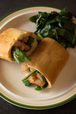 Ciabatta sandwich with salmon, spinach and arugula