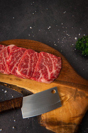 Raw fresh wagyu beef sirloin steak on wooden cutting board