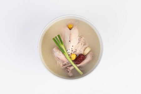 chicken soup in a bowl on a white background. chinese cuisineの写真素材